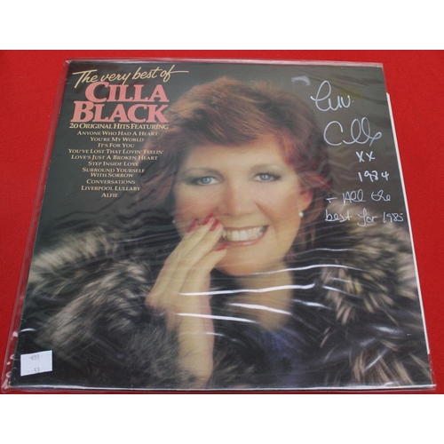 118 - A signed Cilla Black LP record together with three books, 