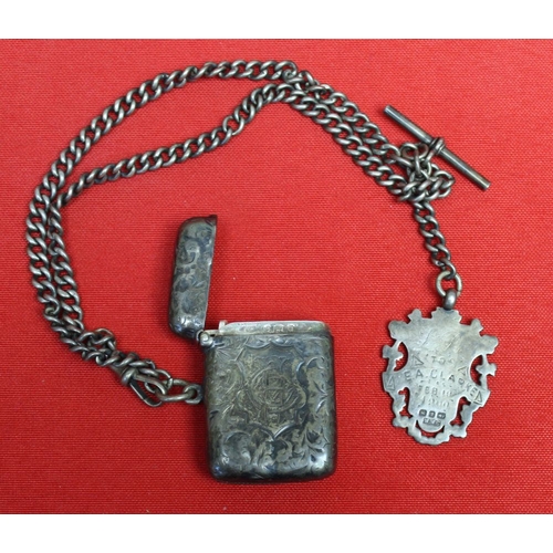 132 - A figurative silver cigar cutter, a silver vesta, watch chain and fobs, combined gross weight 104g