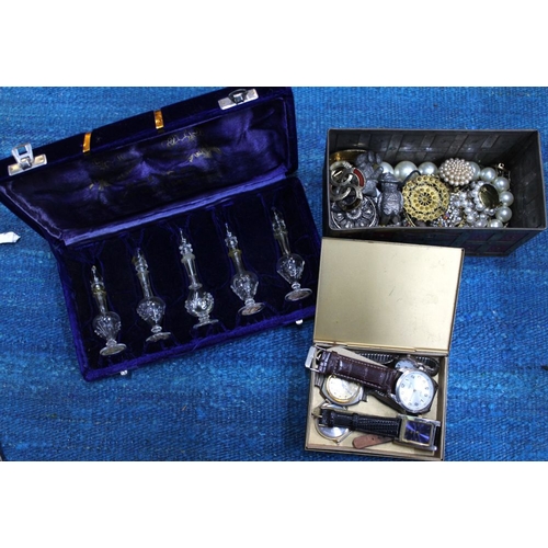 143 - A box containing costume jewellery, a box of watches and a boxed set of Indian perfume bottles