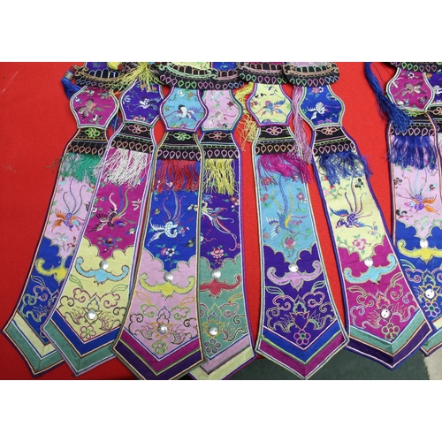 145 - A belt of embroidered, multi silk and embroidered hanging sash panels