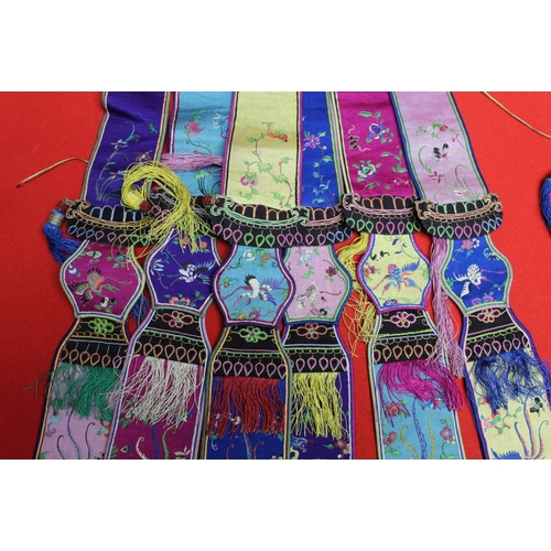 145 - A belt of embroidered, multi silk and embroidered hanging sash panels