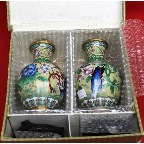 148 - A pair of Chinese Cloisonne vases, baluster form, floral decoration on a yellow ground, 17cm high, w... 