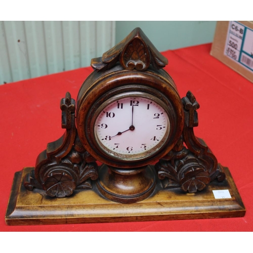 18 - A Black Forest style decorative carved wood framed mantel clock. c.1900