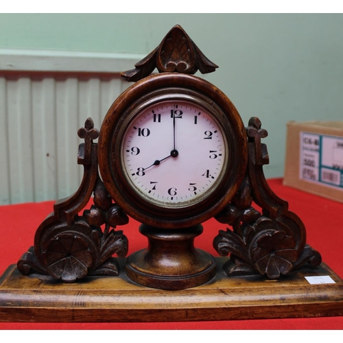 18 - A Black Forest style decorative carved wood framed mantel clock. c.1900