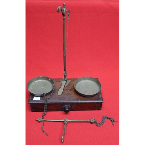 290 - A box base brass balance scale, marked 