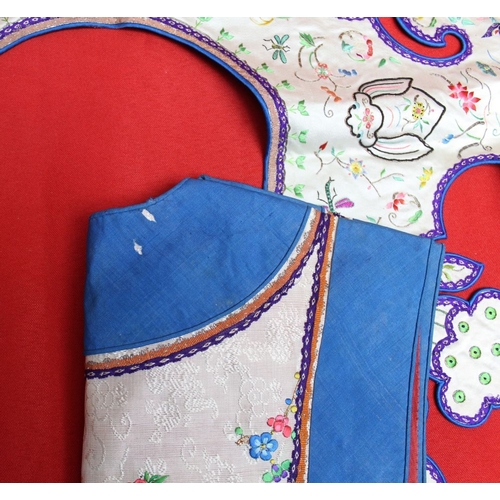 301 - A blue bordered embroidered waistcoat, and separate collar