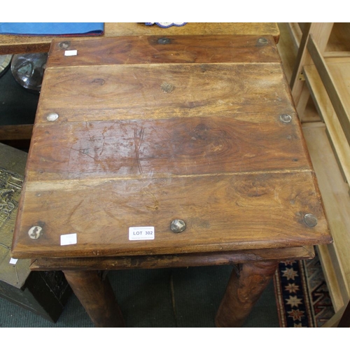 302 - An imported hardwood square occasional table with metal decoration