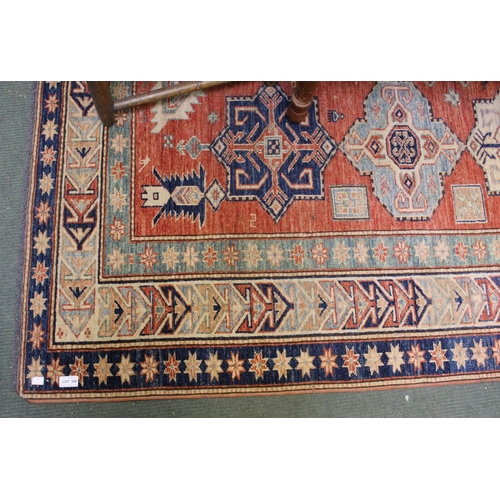 308 - A red and blue ground floor rug with geometric pattern 230 x 157 cm