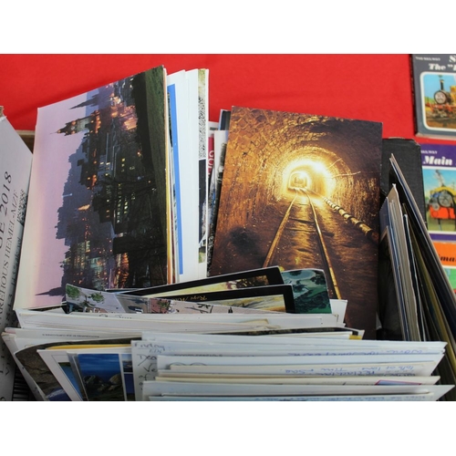 321 - A quantity of books includes childrens annuals, also Rev Awdry Railway books, postcards etc