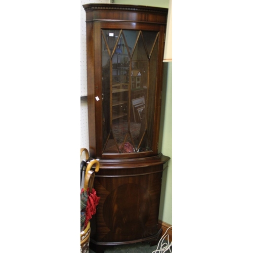 41 - A reproduction floor standing corner cupboard