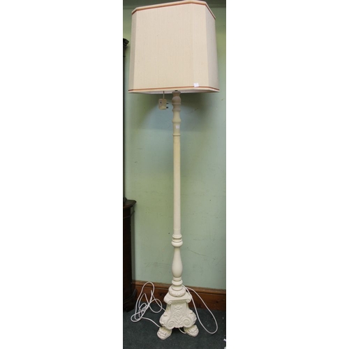 46 - A tall standard lamp on ornate cast plaster base