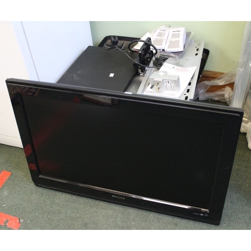 53 - A Philips flat screen television with wall mounting and stand with a signal booster and an electroni... 