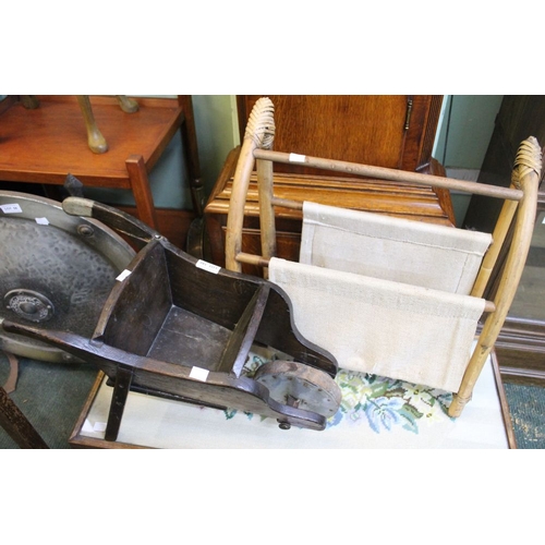 55 - A bamboo magazine rack with a miniature wheel barrow