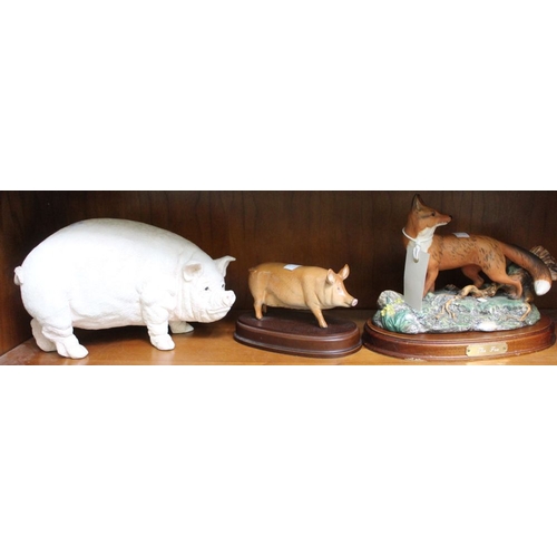 82 - A heavy ceramic pig with another on plinth and a Doulton fox