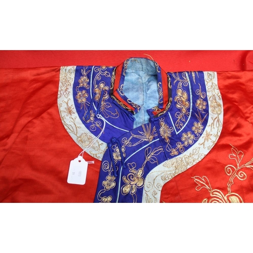 320 - A Chinese embroidered red silk jacket