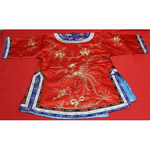 320 - A Chinese embroidered red silk jacket