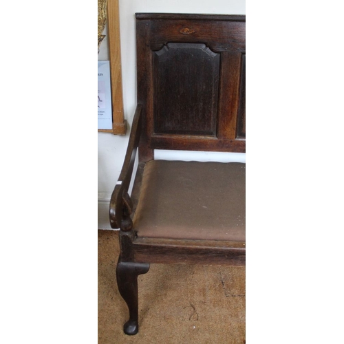 341 - A substantial 19th century oak settle with shell decoration to top panel