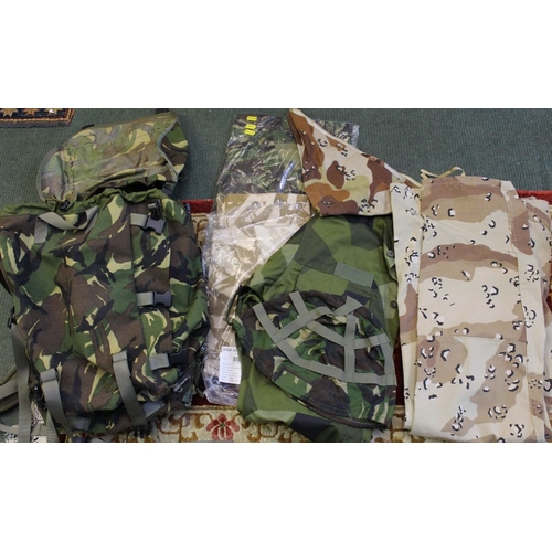 171 - Two boxes of Army surplus - NATO camouflage, combat jackets, trousers, helmet covers, mits, tank ove... 