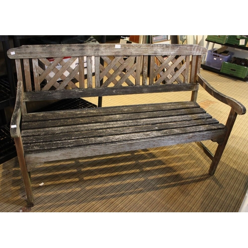 173 - A slatted garden bench with lattice back