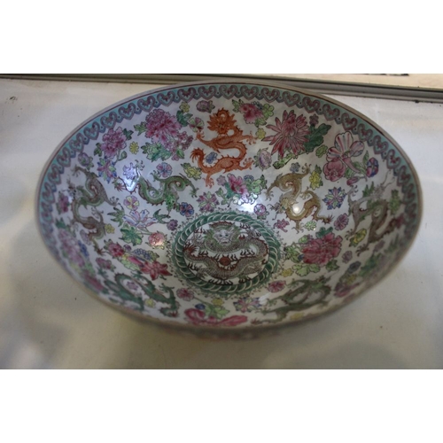 220 - A Chinese eggshell porcelain bowl, 24cm diameter, decorated with dragons, chrysanthemums & lotus flo... 