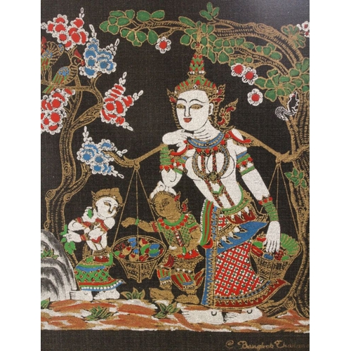 264 - Two framed and glazed Thai silks depicting religious characters