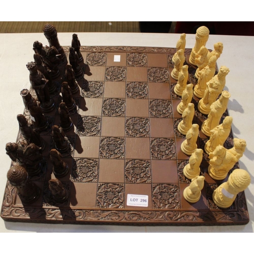 296 - A modern resin figural chess set and board