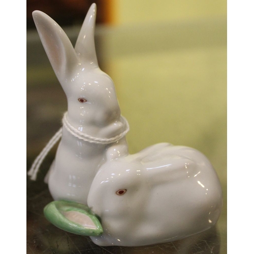 299 - Two Herend porcelain items, includes a rabbit in green decoration and a double rabbit group with mai... 