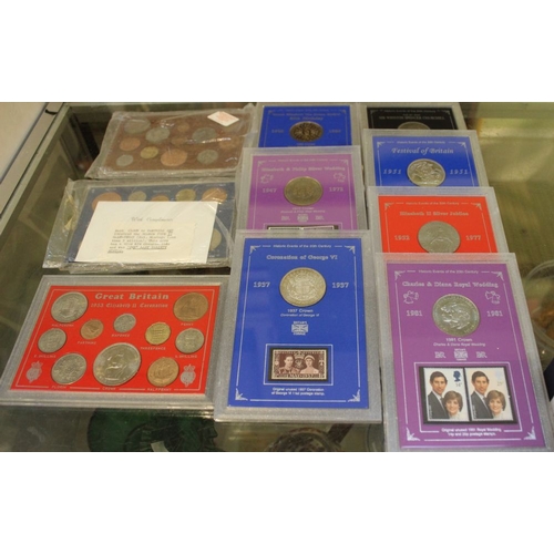 303 - A collection of clip cased coin sets, includes coin/stamp sets, 