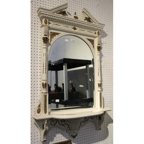 41 - A cream and gilded frame bevelled edge arched pier style wall mirror