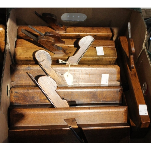 45 - A box containing 7 Victorian wooden moulding planes and a selection of spare blades