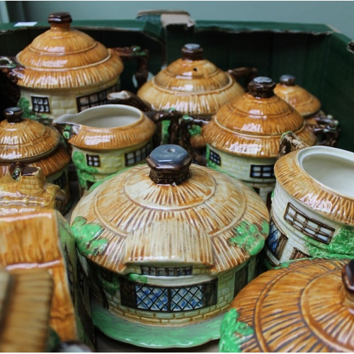 60 - A quantity of Beswick cottage ware, includes teapots, jugs, biscuit barrel etc