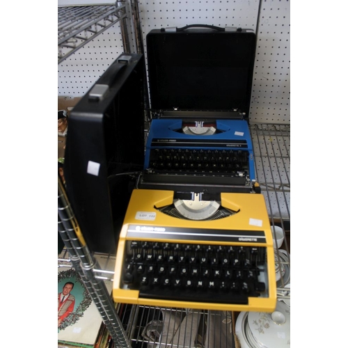 122 - Two vintage Silver-Reed Silverette portable type writers