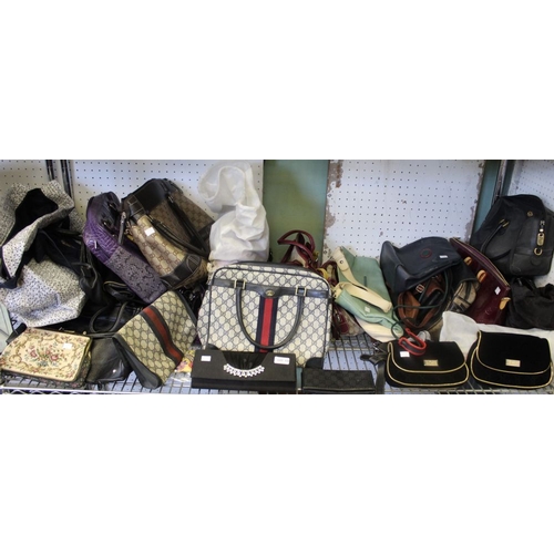 133 - A large quantity of handbags, clutch bags and purses etc