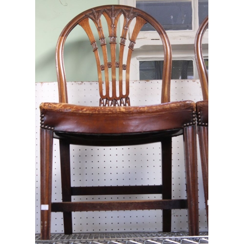 137 - A set of ten mahogany hoop back dining chairs with studded leather seats, 2 carvers