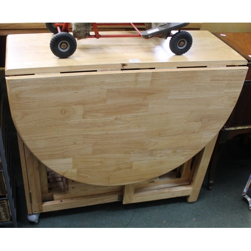 157 - A modern twin-flap hardwood kitchen table with internally stored chairs