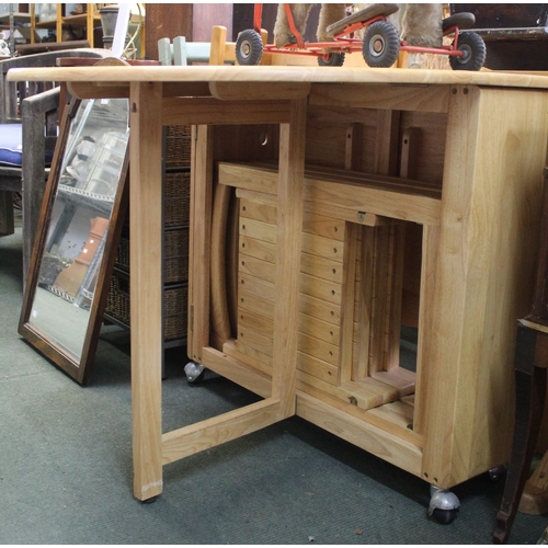 157 - A modern twin-flap hardwood kitchen table with internally stored chairs