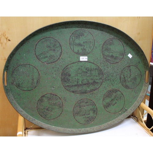 162 - A large oval green painted tin tray decorated with country scenes possibly 19th century Tole Peinte