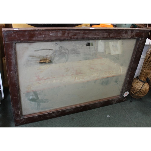 176 - A large wooden framed mirror