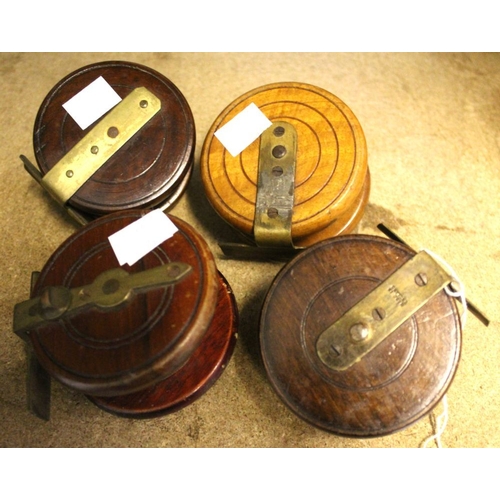 20 - Four vintage wooden fly reels