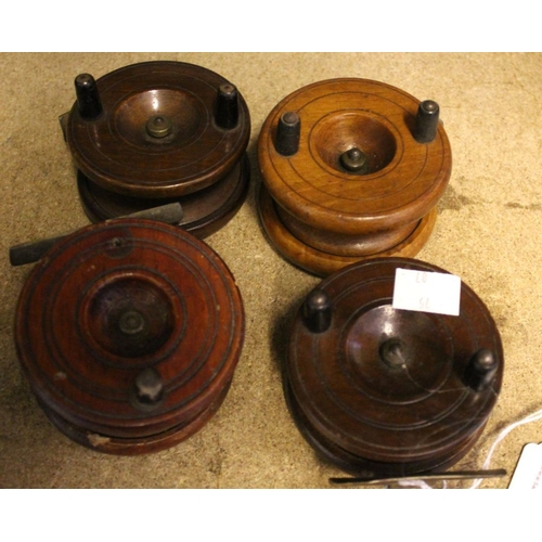 20 - Four vintage wooden fly reels