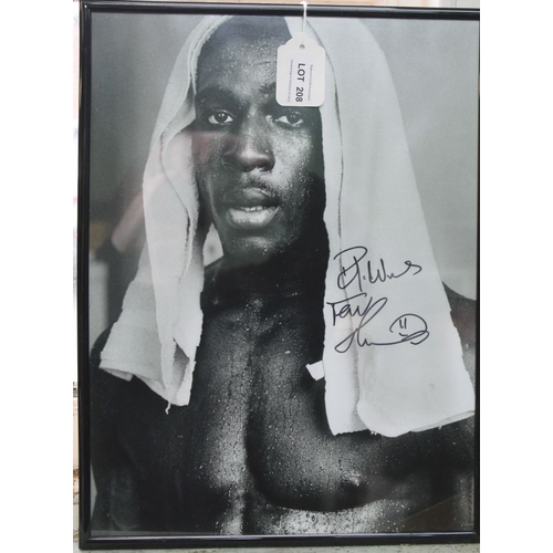 208 - Signed and framed photo of ex heavyweight boxing champion Frank Bruno