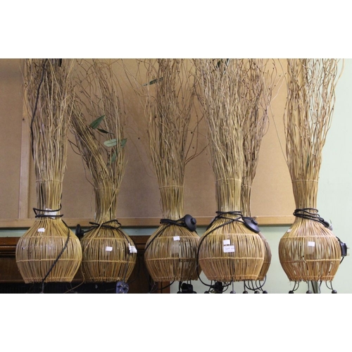 220 - Six floor standing wicker lamps