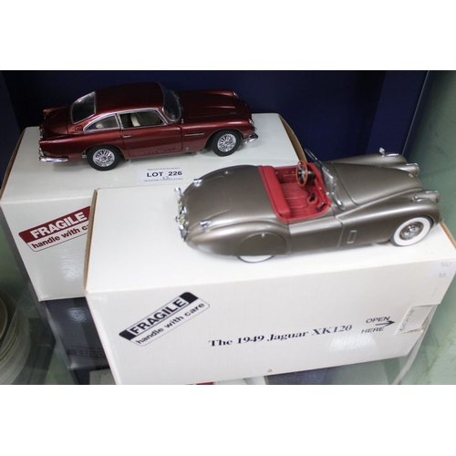 226 - Two Danbury Mint model cars, being a 1964 Aston Martin DB5 and a1949 Jaguar XK120 (2)