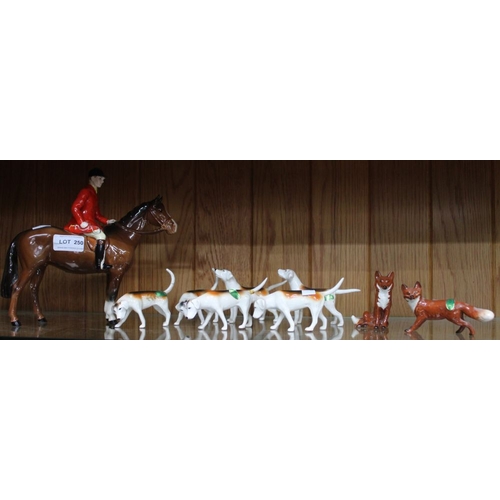 250 - Beswick - Hunting Group, huntsman on brown horse, six hounds and two foxes