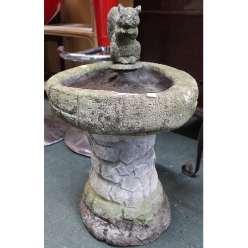 265 - A small cast garden birdbath with squirrel