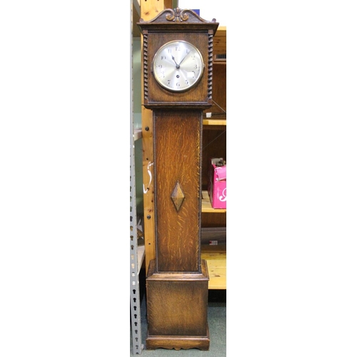 28 - A 20th century oak cased grandmother clock, silvered dial fitted chiming movement with key 136cm hig... 