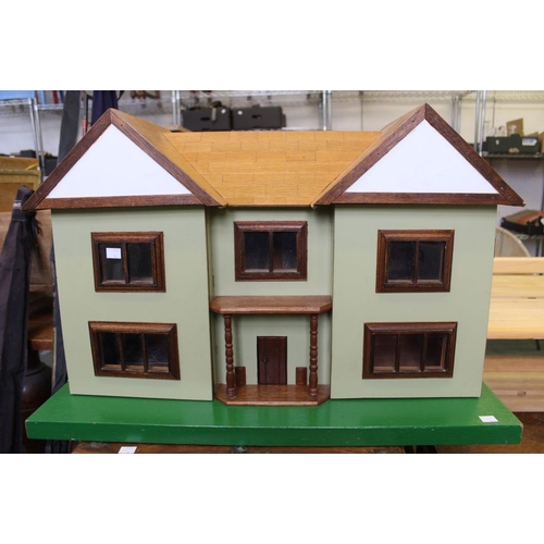 29 - A substantial scratch built dolls house with a selection of furniture