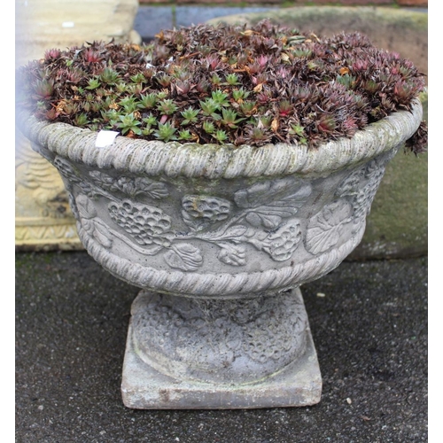 296 - A cast garden planter on stand containing succulents