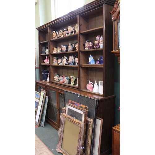 64 - A large and imposing 19th century glazed front bookcase. Having four doors to lower section and four... 