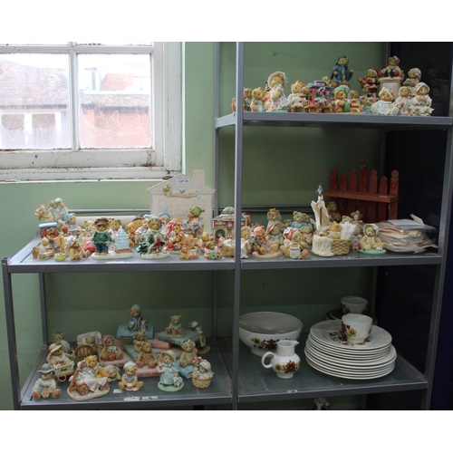 65 - A large quantity of ceramic teddy bear figures including display stands certificates etc. 